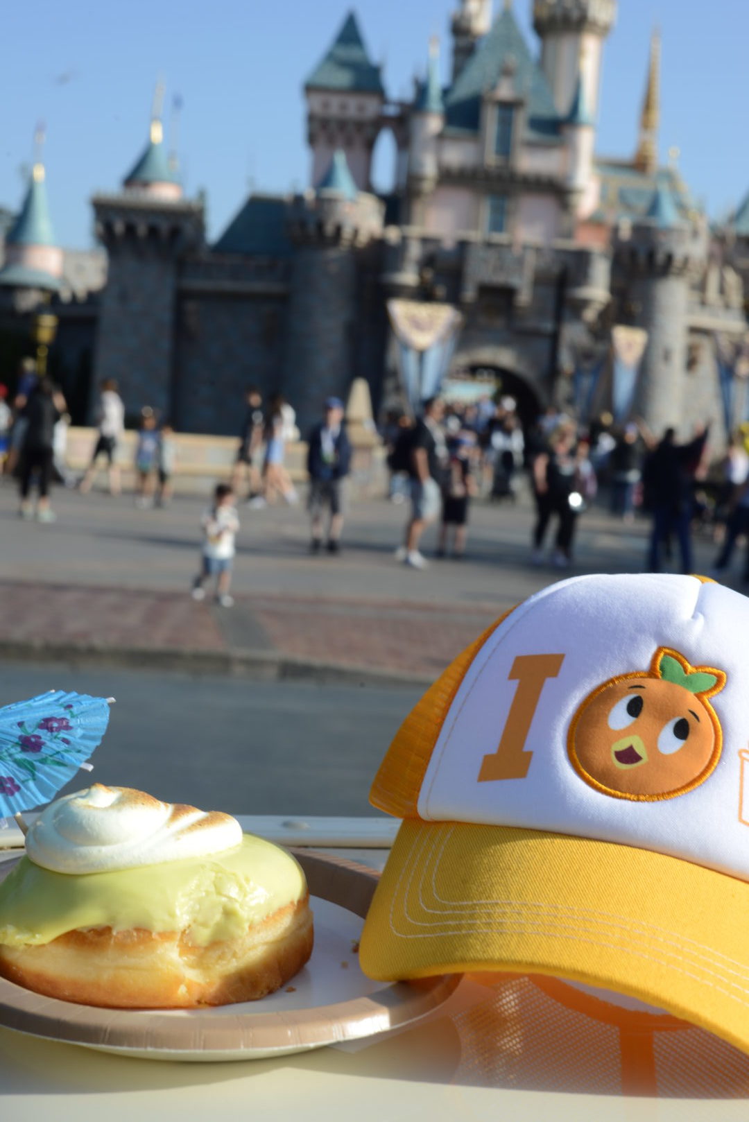 Dole Whip Donut from the Cappuccino Cart in front of Sleeping Beauty Castle | Where to Find Good Coffee at Disneyland