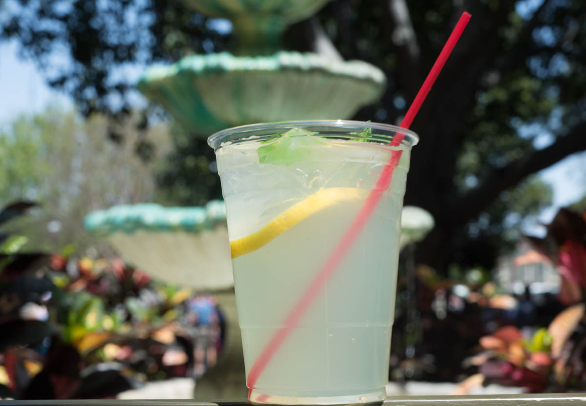 Mint Julep Drink with a Lemon Wedge in front of New Orleans Fountain in Disneyland