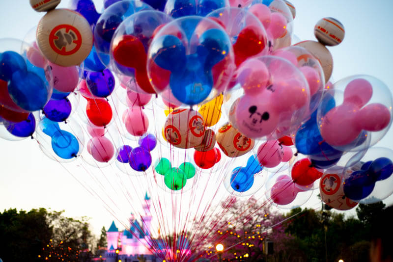 Colored Mickey Balloons with Sleeping Beauty Castle Disneyland