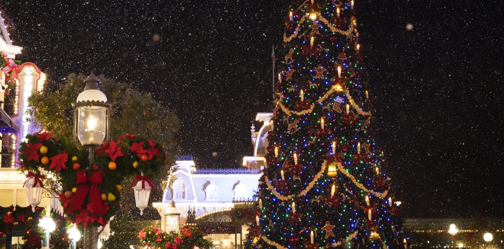 Christmas Tree with Mickey Christmas Wreath and Snow on Main Street