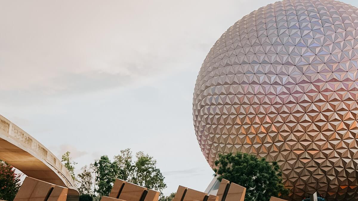 Epcot's Spaceship Earth in a pink filter and monorail track