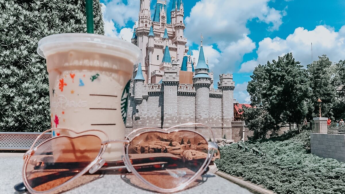 Iced latte in front of Cinderella Castle in Disney World
